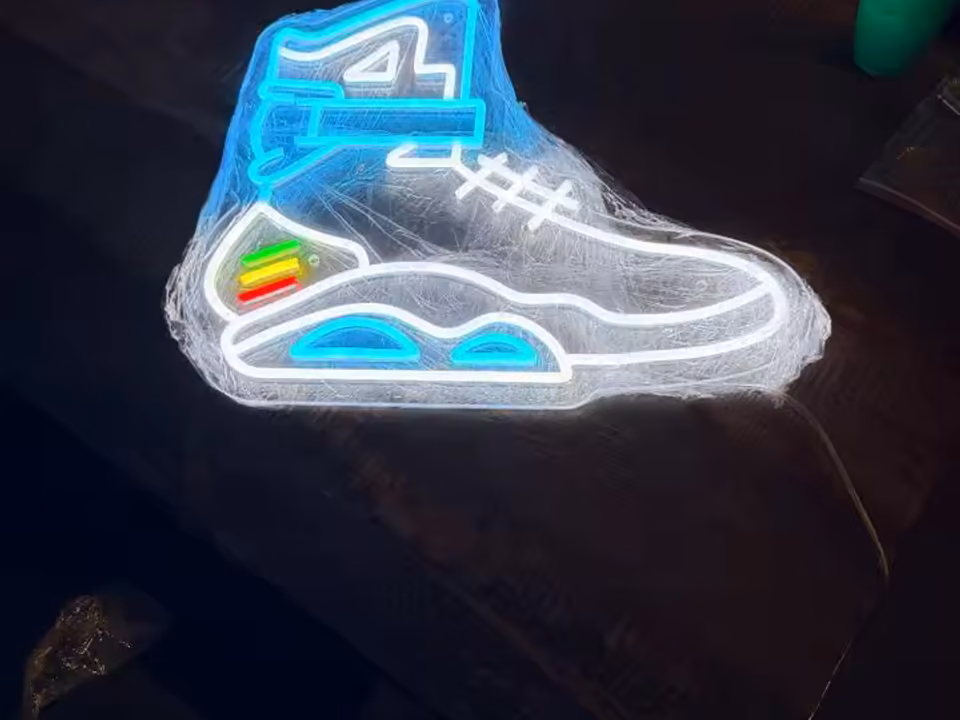 Colourful custom neon sign in a gaming room